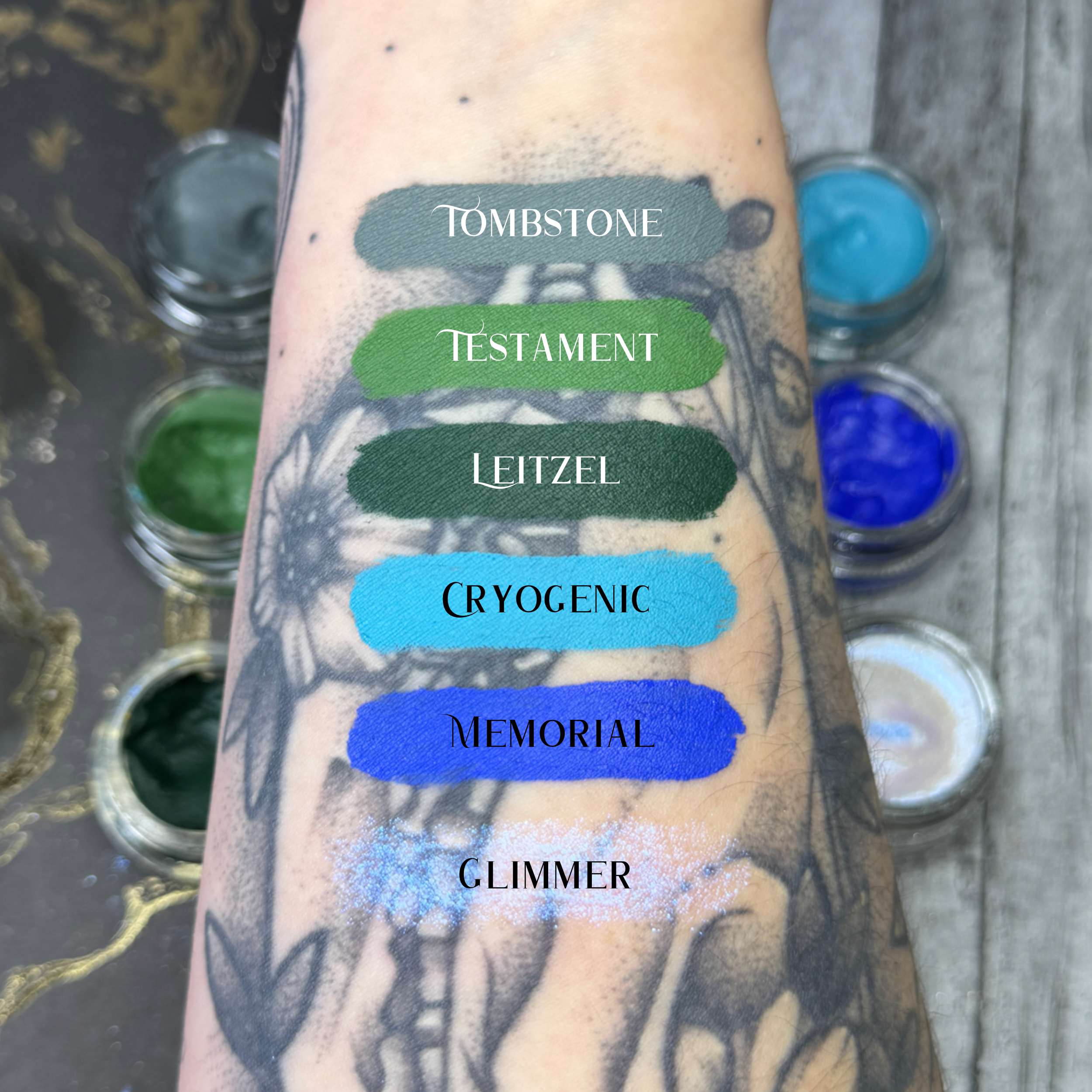 FAIR SKIN TONE ARM SWATCH WITH FUNERAL PROOF EYELINER SWATCHES COVERING OVER TATTOOS #SHADES_TOMBSTONE,TESTAMENT,LEITZEL,CRYOGENIC,MEMORIAL,GLIMMER (SHEER INTERFERENCE)