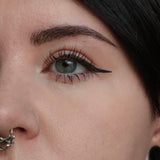 eye with winged eyeliner 
#SHADES_OBITCHUARY