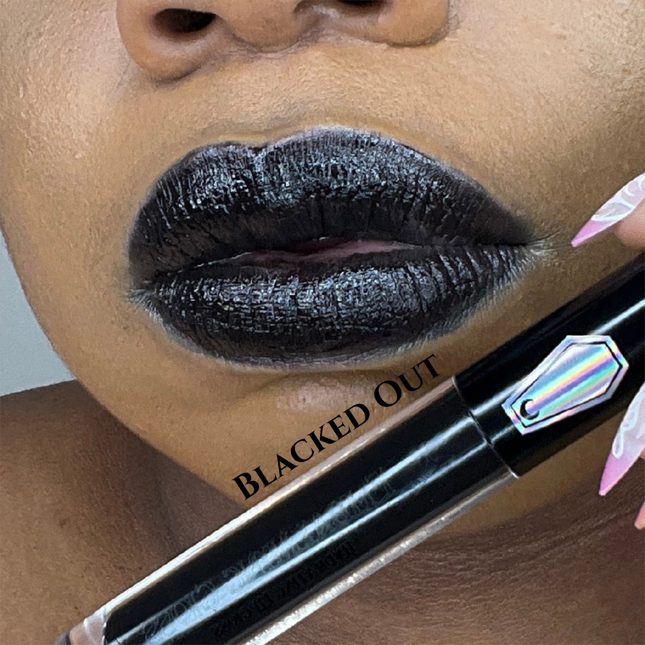 LIP SWATCH OF THE EMBALMING HYDRATING LIPGLOSS IN 
#SHADES_BLACKED OUT