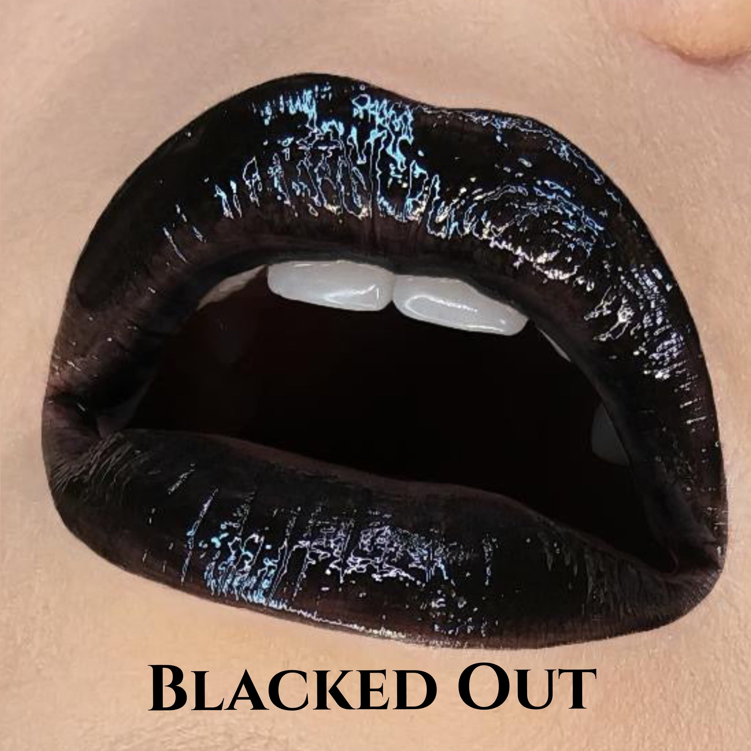 LIP SWATCH OF THE EMBALMING HYDRATING LIPGLOSS IN 
#SHADES_BLACKED OUT