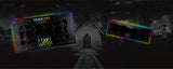 TWO HOLOGRAVE COSMETICS BUILD YOUR OWN MOON WATER LINER PALETTES (WATER ACTIVATED EYELINER)  IN VARIANTS OF 18 PANS AND 4 PANS WITH RAINBOW AURA SURROUNDING THEM IN FRONT OF A MAUSOLEUM TYPE CEMETERY BUILDING WITH A WALKWAY LEADING UP