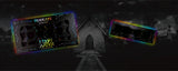 TWO HOLOGRAVE COSMETICS BUILD YOUR OWN MOON WATER LINER PALETTES (WATER ACTIVATED EYELINER)  IN VARIANTS OF 18 PANS AND 4 PANS WITH RAINBOW AURA SURROUNDING THEM IN FRONT OF A MAUSOLEUM TYPE CEMETERY BUILDING WITH A WALKWAY LEADING UP