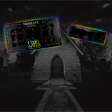 TWO HOLOGRAVE COSMETICS BUILD YOUR OWN MOON WATER LINER PALETTES (WATER ACTIVATED EYELINER)  IN VARIANTS OF 18 PANS AND 4 PANS WITH RAINBOW AURA SURROUNDING THEM IN FRONT OF A MAUSOLEUM TYPE CEMETERY BUILDING WITH A WALKWAY LEADING UP