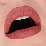HOLLOWED COSMETICS LIP MUD CLOSE UP SHOT OF SHADE HB 454 A midtone red-pink