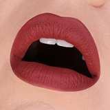 HOLLOWED COSMETICS LIP MUD CLOSE UP SHOT OF SHADE HB 448 A darker red-pink