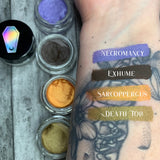 FAIR SKIN TONE ARM SWATCH WITH FUNERAL PROOF EYELINER SWATCHES COVERING OVER TATTOOS #SHADES_necromancy (metallic shimmer),exhume,sarcoppergus (metallic shimmer),death toll (metallic shimmer)