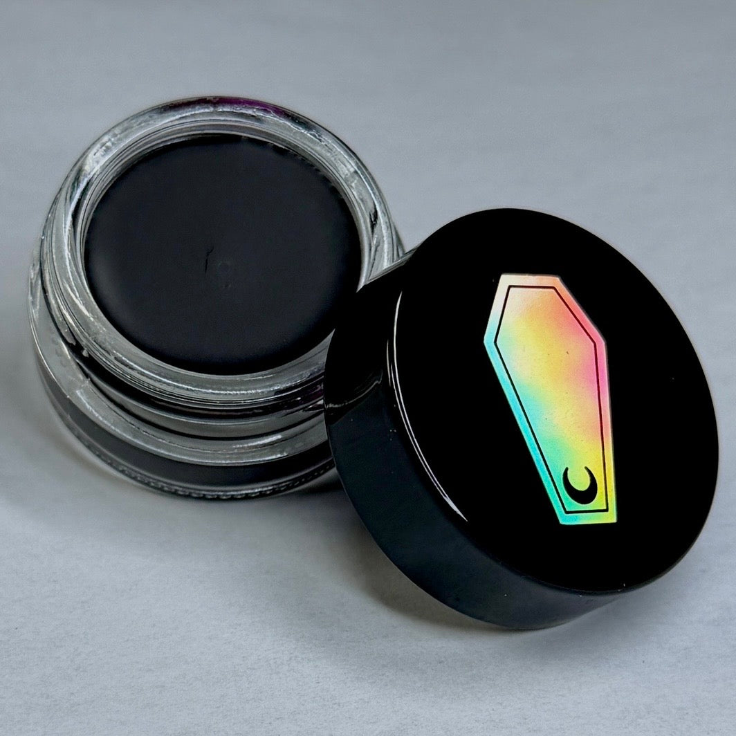 GLASS CIRCLE JAR WATER PROOF FUNERAL PROOF EYELINER/BROW POMADE BY HOLOGRAVE COSMETICS IN THE ULTRA BLACK SHADE OBITCHUARY #SHADES_OBITCHUARY